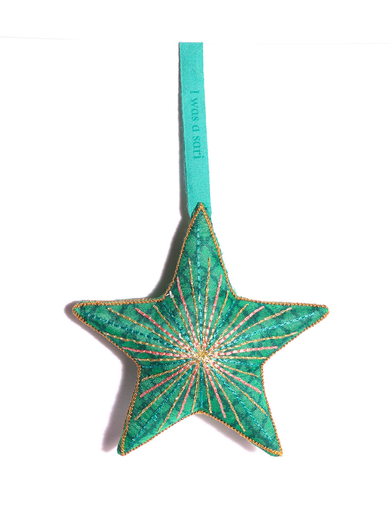 Timeless star ornament made from recycled sari fabric, featuring silk and metallic embroidery, crafted as part of green fashion, recycled clothing design, environmentally friendly clothing practices, and repurposed clothing traditions.