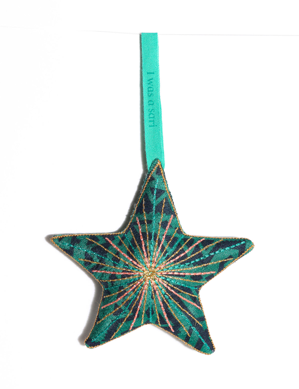 Timeless star ornament made from recycled sari fabric, featuring silk and metallic embroidery, crafted as part of green fashion, recycled clothing design, environmentally friendly clothing practices, and repurposed clothing traditions.