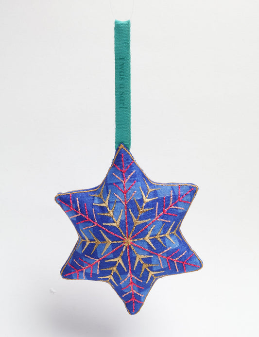 Timeless snowflake ornament made from preloved sari fabric with metallic embroidery, promoting green fashion, fair trade fashion, recycled material clothing, repurposed clothing, sustainable women's clothing, and circular fashion for a conscious lifestyle.