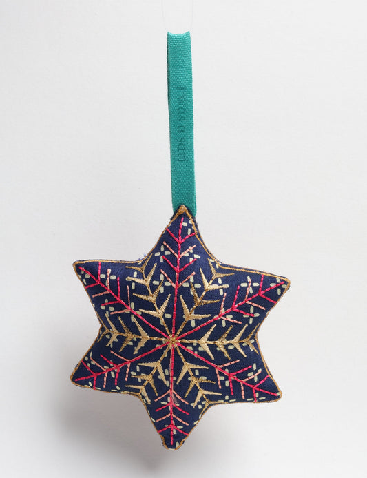 Timeless snowflake ornament made from preloved sari fabric with metallic embroidery, promoting green fashion, fair trade fashion, recycled material clothing, repurposed clothing, sustainable women's clothing, and circular fashion for a conscious lifestyle.