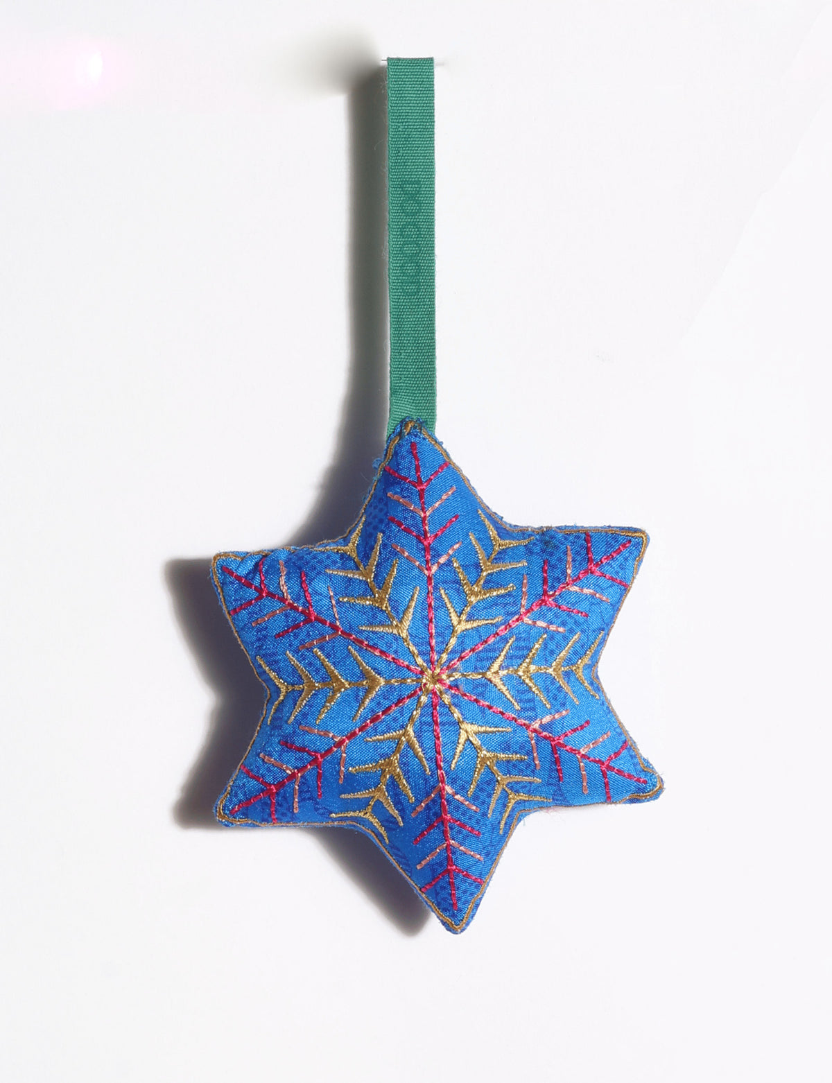 Handcrafted snowflake Christmas ornament made from preloved saris with silk and metallic gold thread embroidery