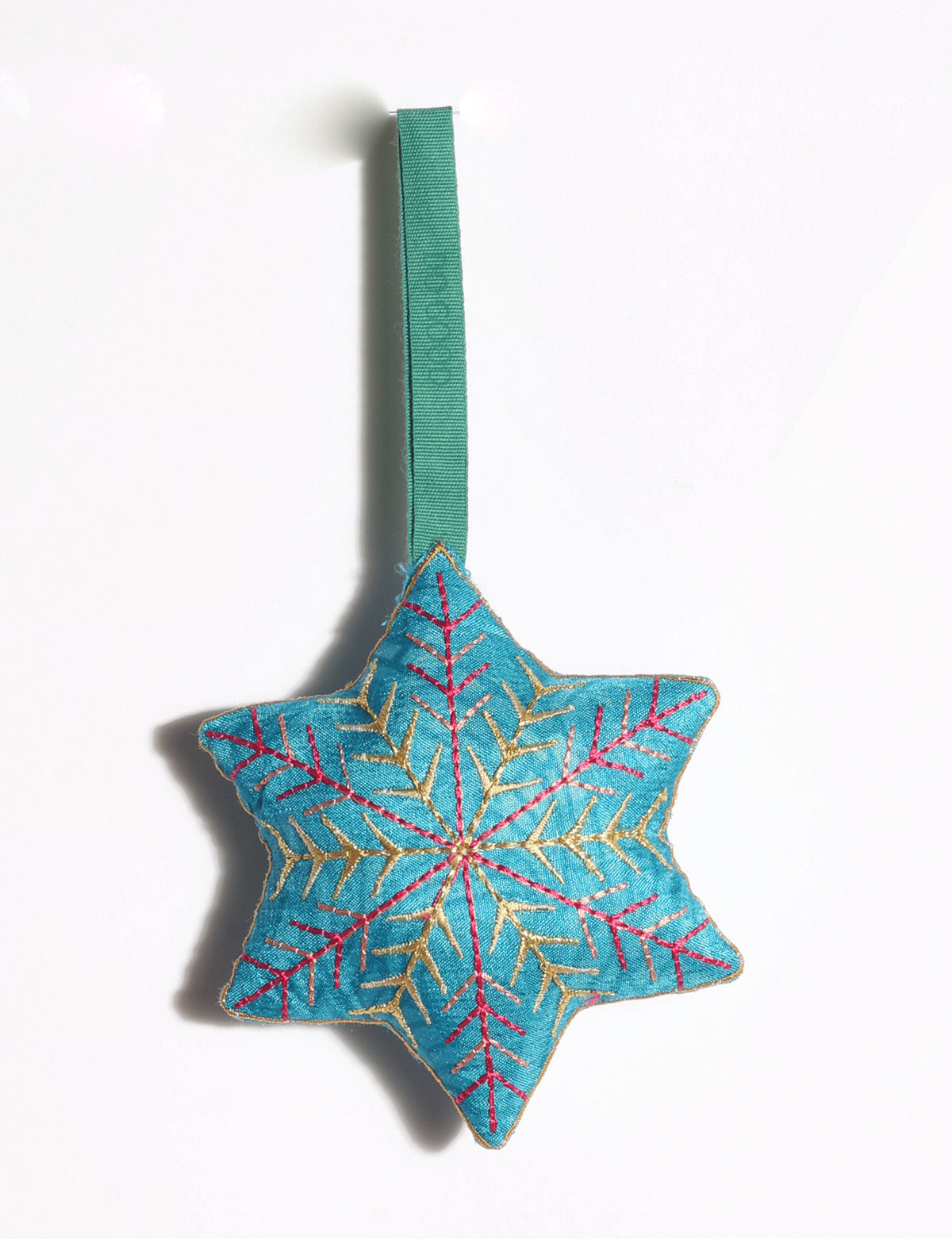 Handcrafted snowflake Christmas ornament made from preloved saris with silk and metallic gold thread embroidery