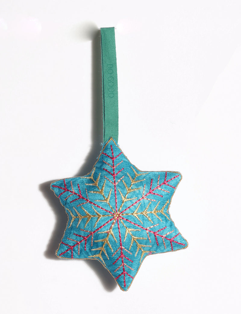 Handcrafted snowflake Christmas ornament made from preloved saris with silk and metallic gold thread embroidery