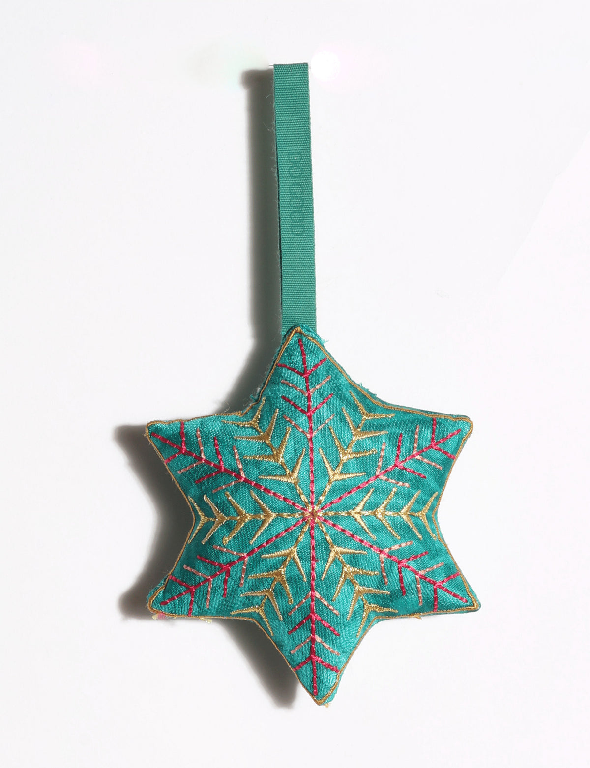 Handcrafted snowflake Christmas ornament made from preloved saris with silk and metallic gold thread embroidery