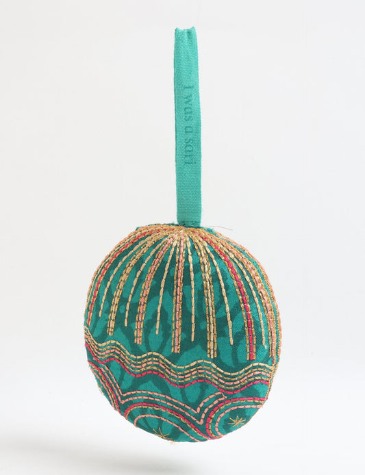 Timeless Full Moon ornament handmade from recycled sari fabric, featuring organic cotton filling and gold thread embroidery — a beautiful piece of upcycled clothing, eco clothing, and sustainable women’s fashion made from repurposed materials.