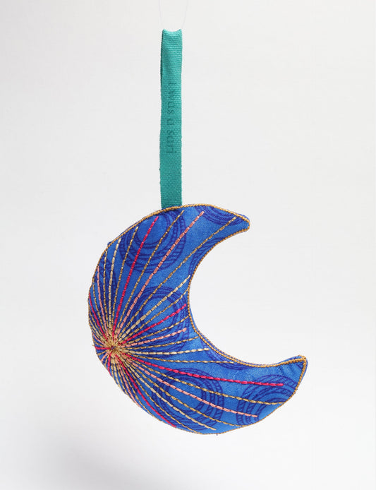 Timeless crescent moon ornament made from recycled materials and textile waste, featuring intricate embroidery. A zero waste and carbon offset accessory that supports circular fashion, fair trade fashion, and environmentally friendly clothing choices.