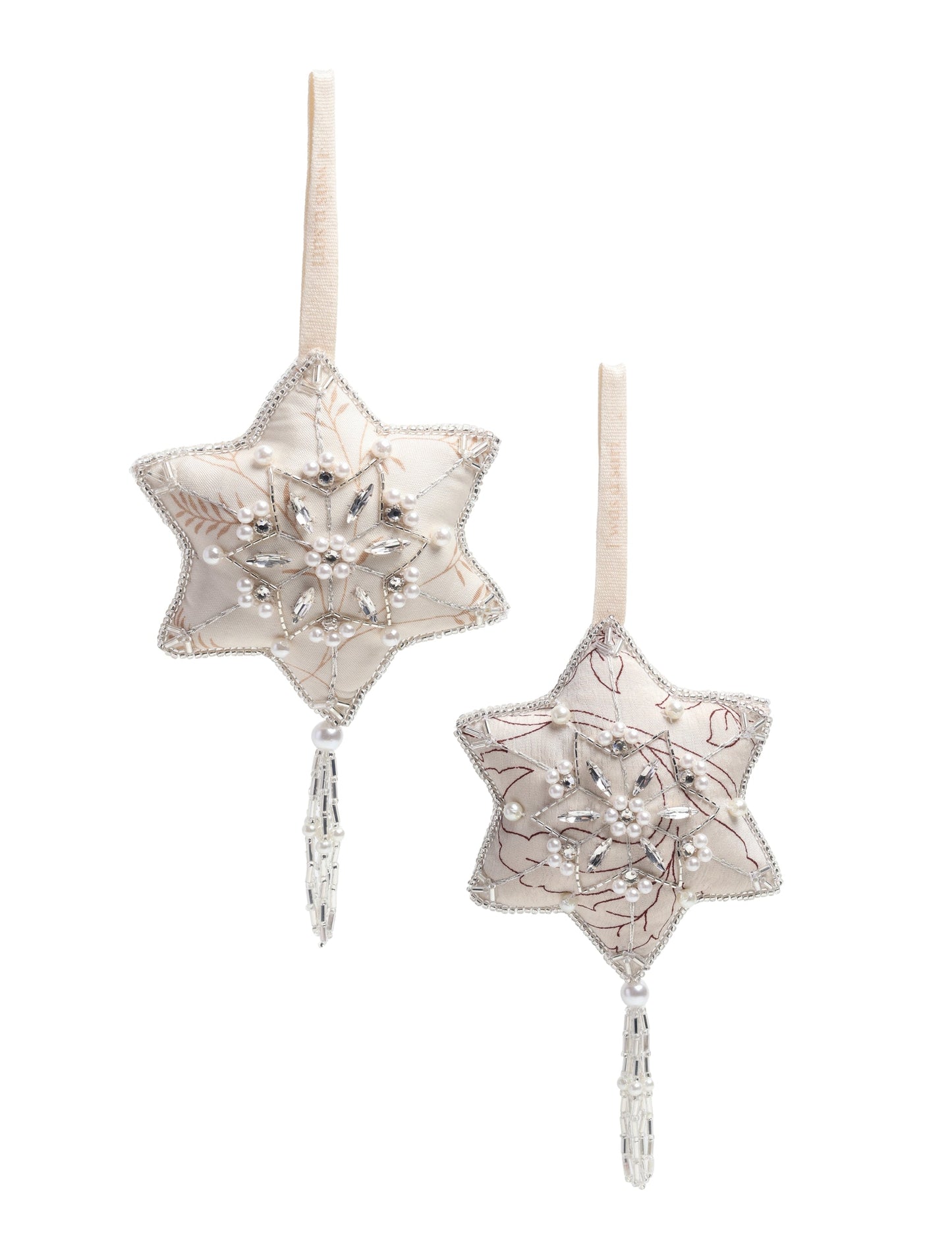 Silver snowflake ornament made from ivory and grey recycled sari products, enhanced with silver beads and pearls. Designed for lovers of eco friendly products, climate neutral clothing, and repurposed clothing, supporting zero waste clothing and conscious clothing movements.