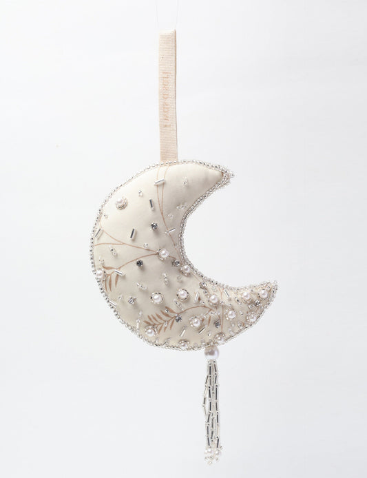 Crescent moon ornament made from recycled clothing, featuring fair trade fashion, clothes made from recycled fabric, and upcycled garments with elegant silver embellishments and tassel, ideal for those who value climate neutral clothing and recycled sustainable fashion.