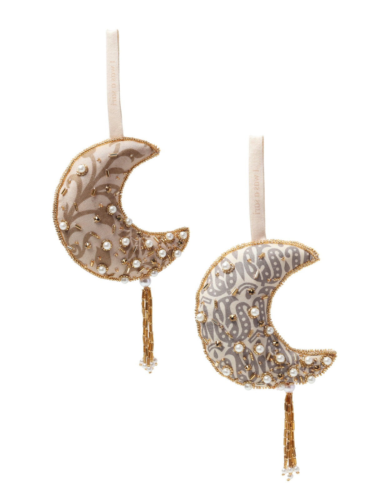 Set of two gold-colored crescent moon ornaments with fabric patterns, pearl and bead embellishments, and hanging loops