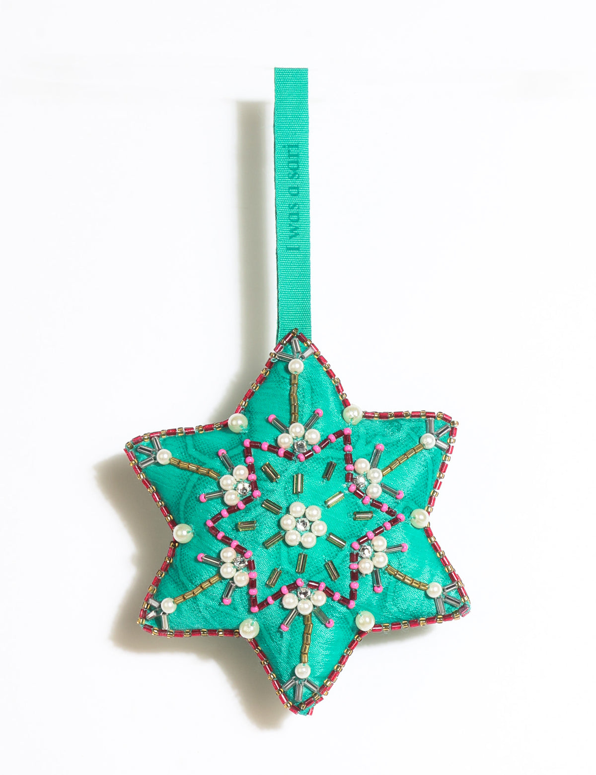 Teal fabric star-shaped snowflake ornament with bead and pearl embellishments, hanging by a teal fabric loop