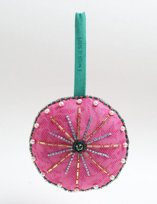 Handcrafted full moon ornament made from recycled sari fabric and embroidered with beads — an example of upcycled clothing and slow fashion, promoting eco clothing, recycled fashion, and conscious clothing practices.