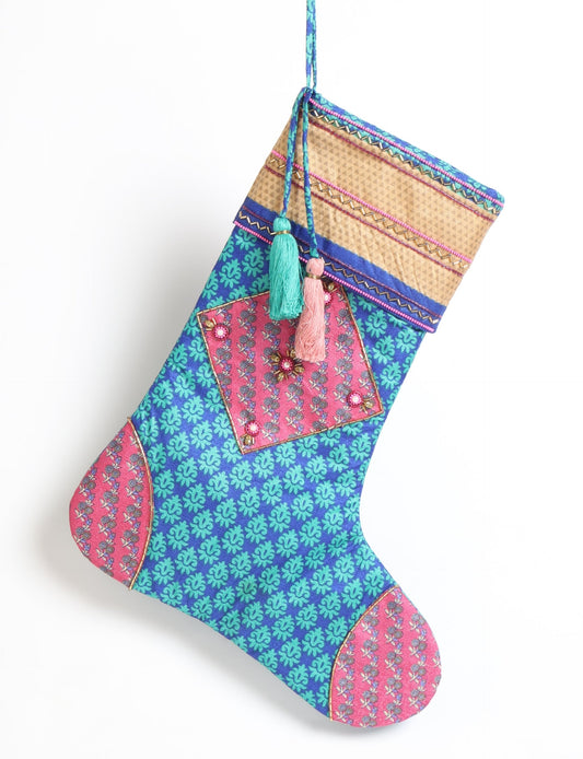 Cheer Christmas stocking made from recycled sari fabric with patchwork, gold hand embroidery, stones, sequins, pearls, glass beads, heart charm, and tassel — upcycled women’s clothing, conscious clothing, green fashion, upcycling fashion, environmentally friendly clothing, products made from textile waste, repurposed clothing, carbon neutral fashion, eco clothing, natural clothing.