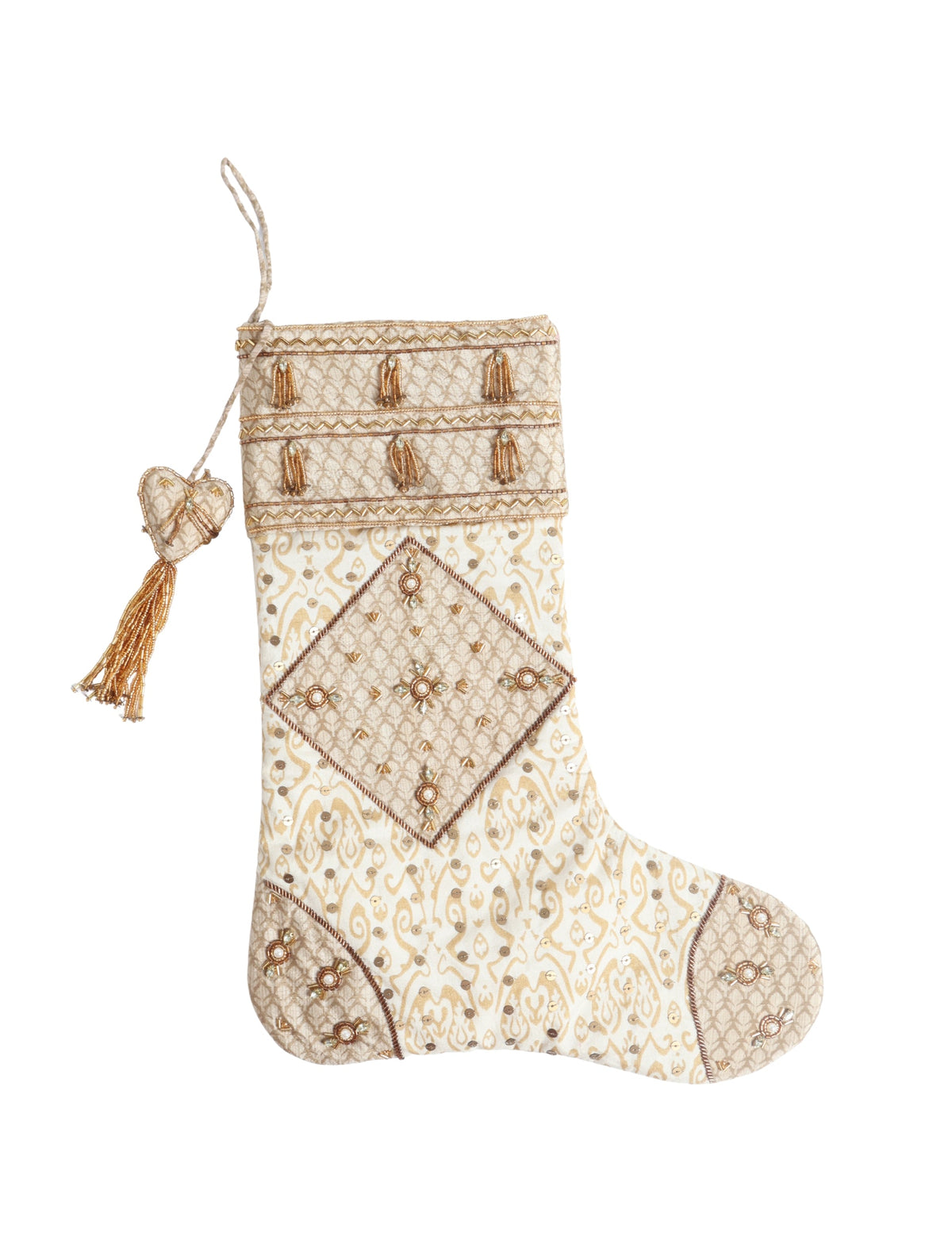 Beige patchwork Christmas stocking with Indian ethnic patterns, gold bead tassels, and sequin embellishments, hanging view