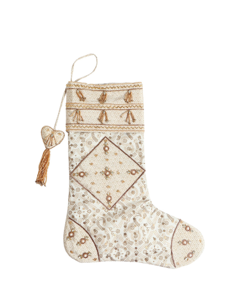 Beige patchwork Christmas stocking with gold bead tassels, floral and geometric embroidery, and hanging loop with heart detail