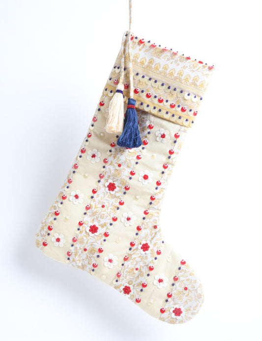 Upcycled sari Christmas stocking with floral beadwork, showcasing ethical fashion, recycled material clothing, fair trade fashion craftsmanship, and environment friendly clothing design.
