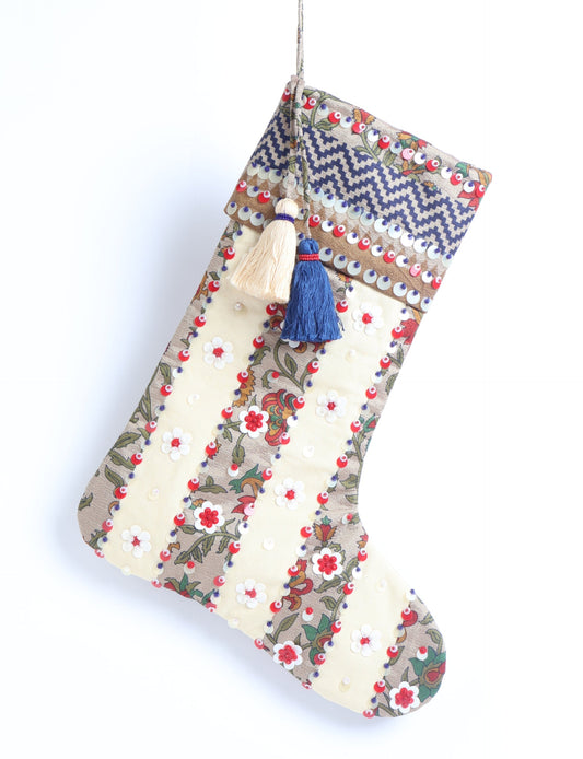 Upcycled sari Christmas stocking with floral beadwork, showcasing ethical fashion, recycled material clothing, fair trade fashion craftsmanship, and environment friendly clothing design.