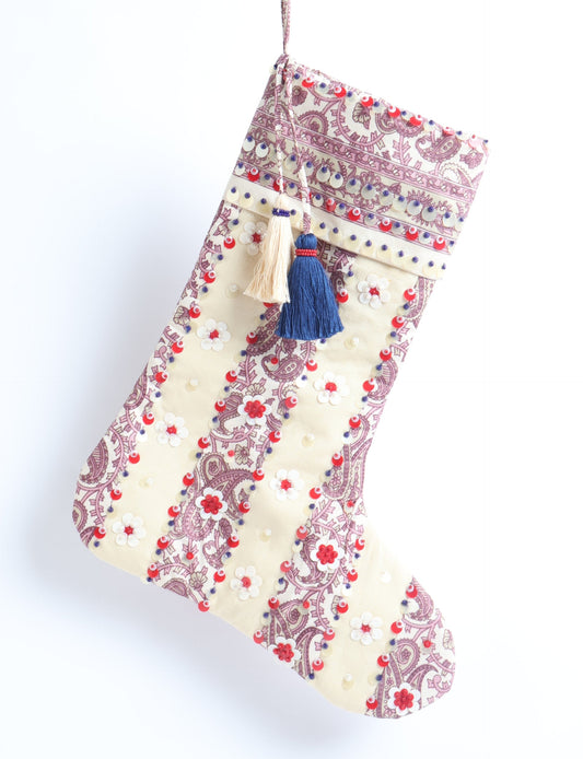 Upcycled sari Christmas stocking with floral beadwork, showcasing ethical fashion, recycled material clothing, fair trade fashion craftsmanship, and environment friendly clothing design.