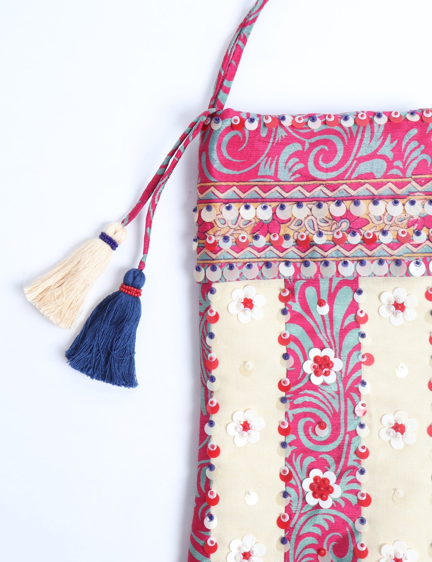 Upcycled sari Christmas stocking with floral beadwork, showcasing ethical fashion, recycled material clothing, fair trade fashion craftsmanship, and environment friendly clothing design.