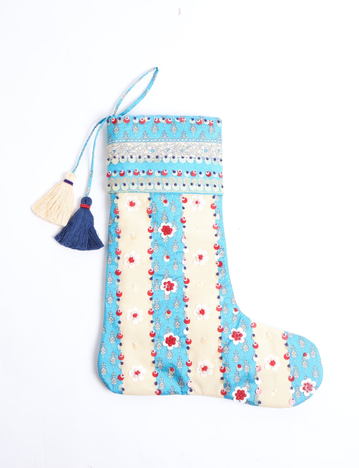 Upcycled sari Christmas stocking with floral beadwork, showcasing ethical fashion, recycled material clothing, fair trade fashion craftsmanship, and environment friendly clothing design.