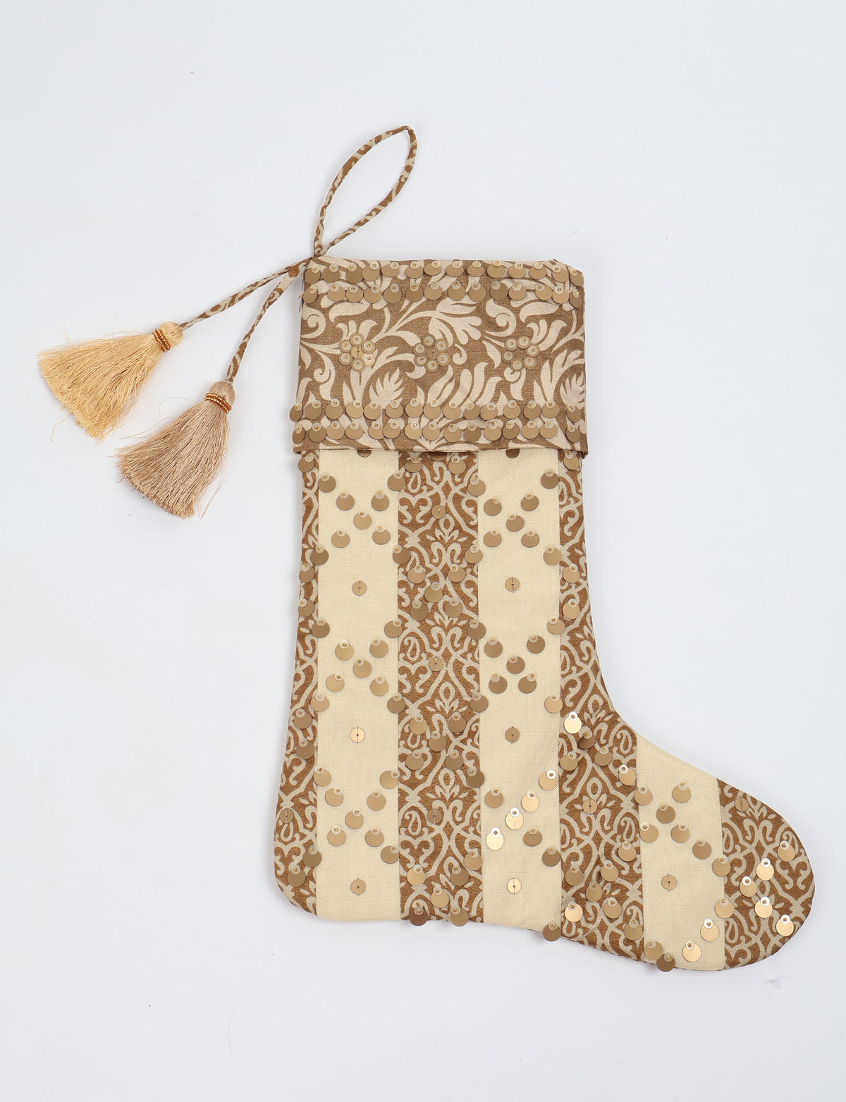 Christmas stocking with beige and brown vertical stripes, floral pattern, gold sequins, and two tassels on hanging loop