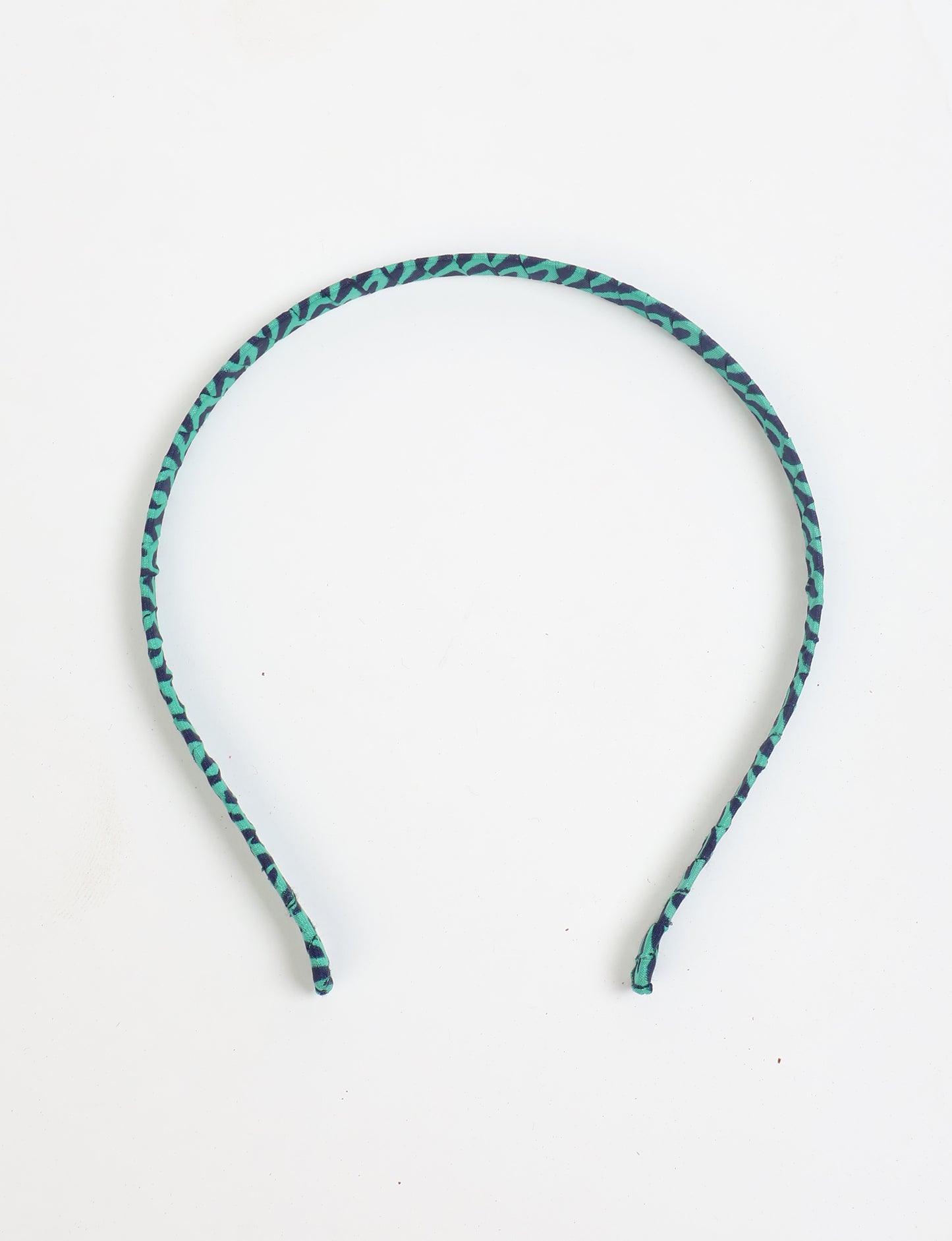 Thin fabric-wrapped metal hairband for a clean and stylish everyday look