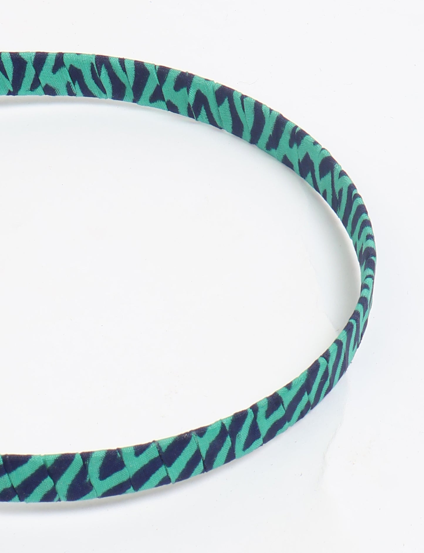 Thin fabric-wrapped metal hairband for a clean and stylish everyday look