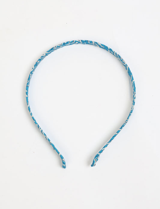 Thin fabric-wrapped metal hairband for a clean and stylish everyday look