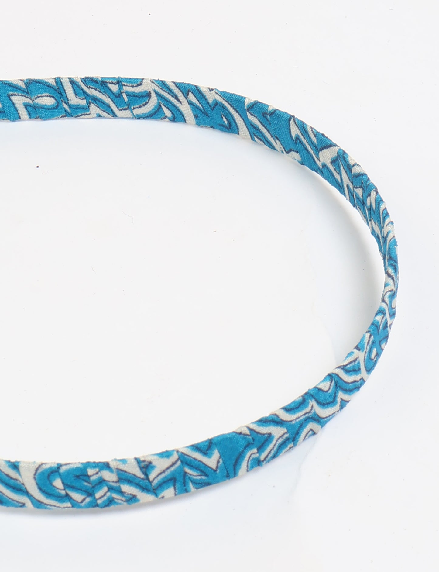 Thin fabric-wrapped metal hairband for a clean and stylish everyday look