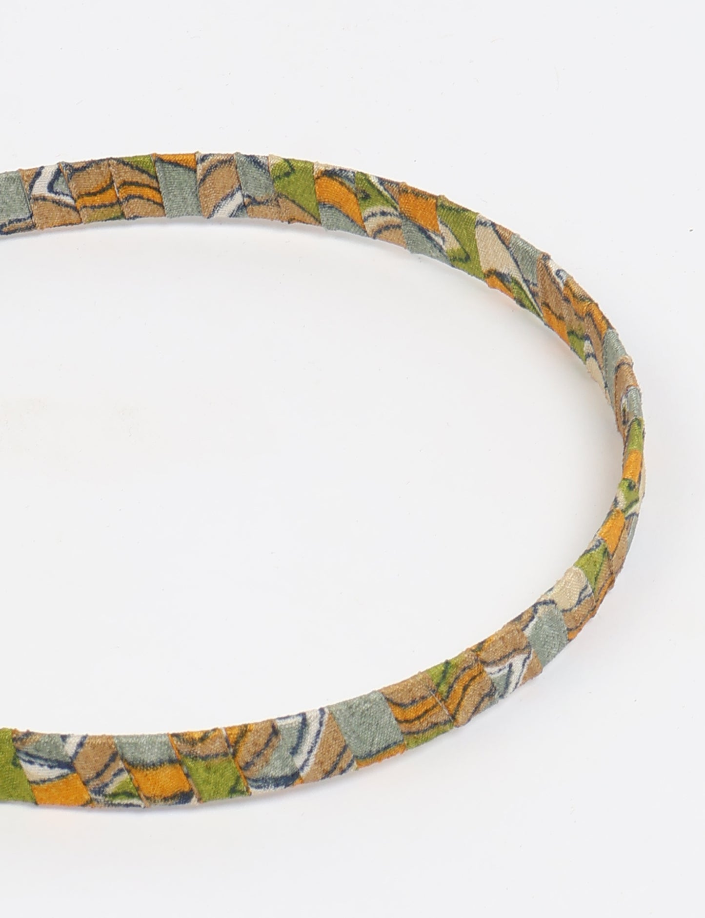 Thin fabric-wrapped metal hairband for a clean and stylish everyday look