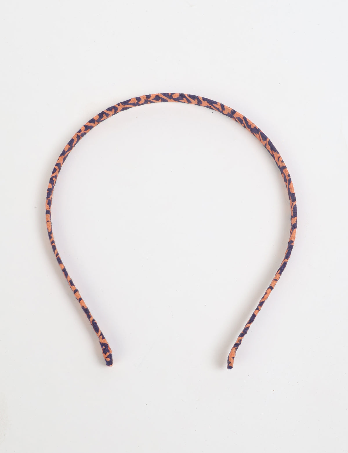 Thin fabric-wrapped metal hairband for a clean and stylish everyday look