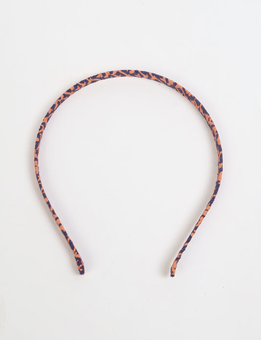 Thin fabric-wrapped metal hairband for a clean and stylish everyday look