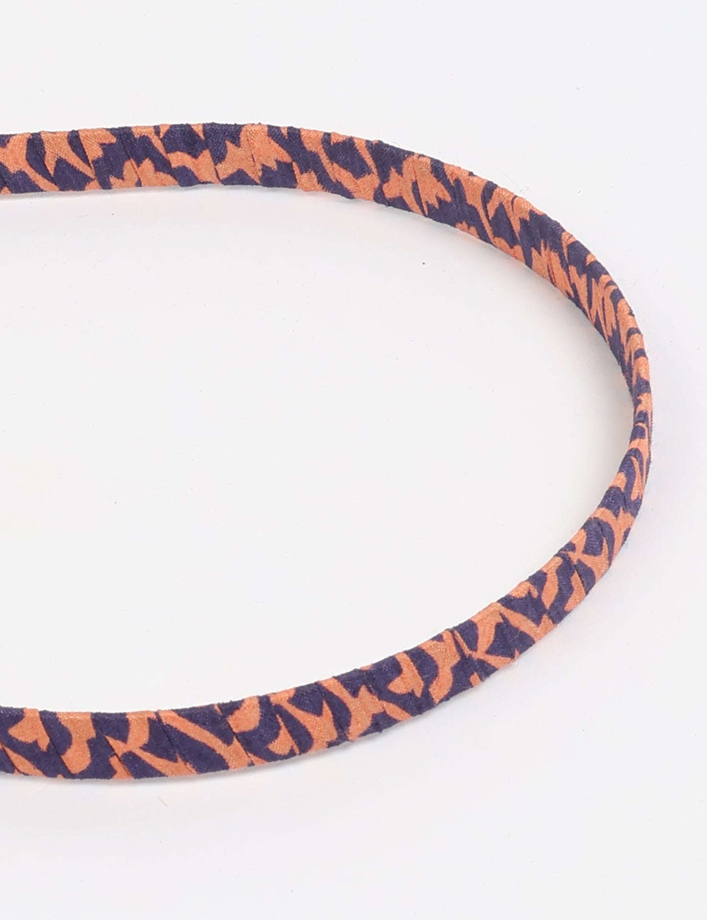 Thin fabric-wrapped metal hairband for a clean and stylish everyday look