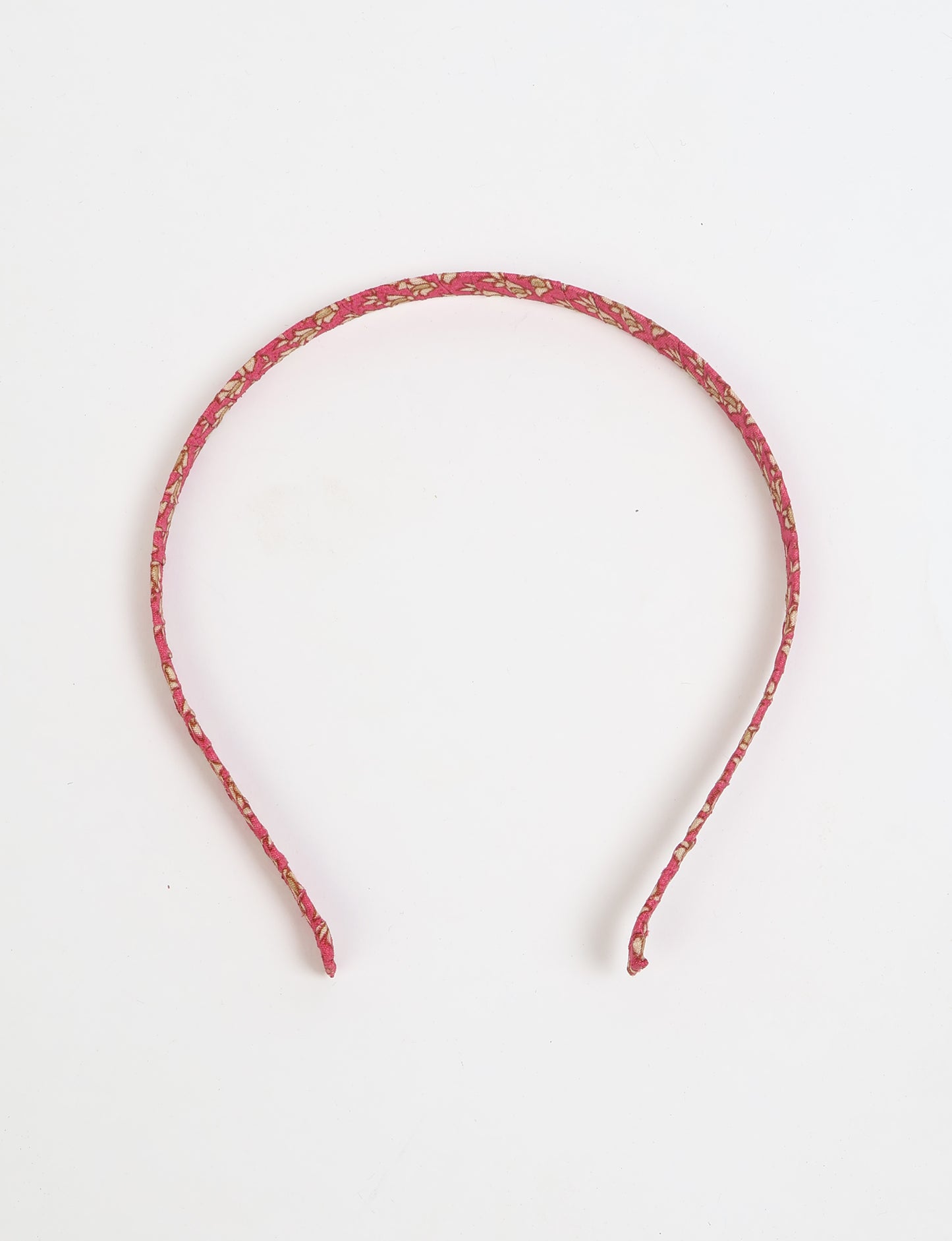 Thin fabric-wrapped metal hairband for a clean and stylish everyday look