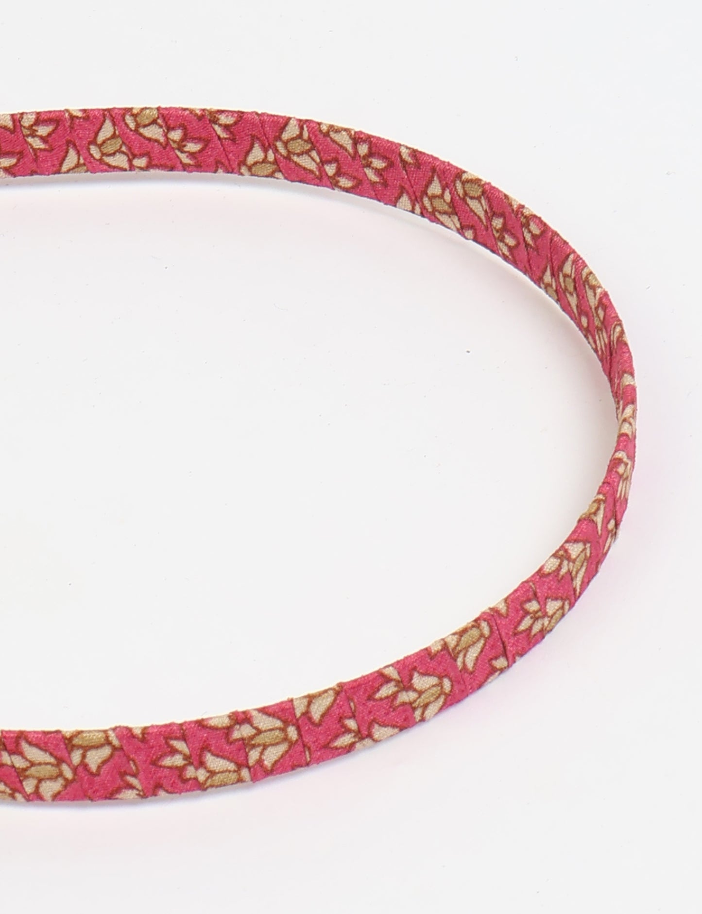 Thin fabric-wrapped metal hairband for a clean and stylish everyday look