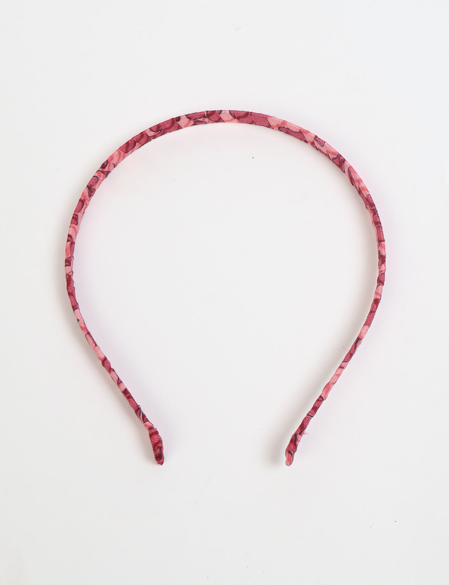Thin fabric-wrapped metal hairband for a clean and stylish everyday look