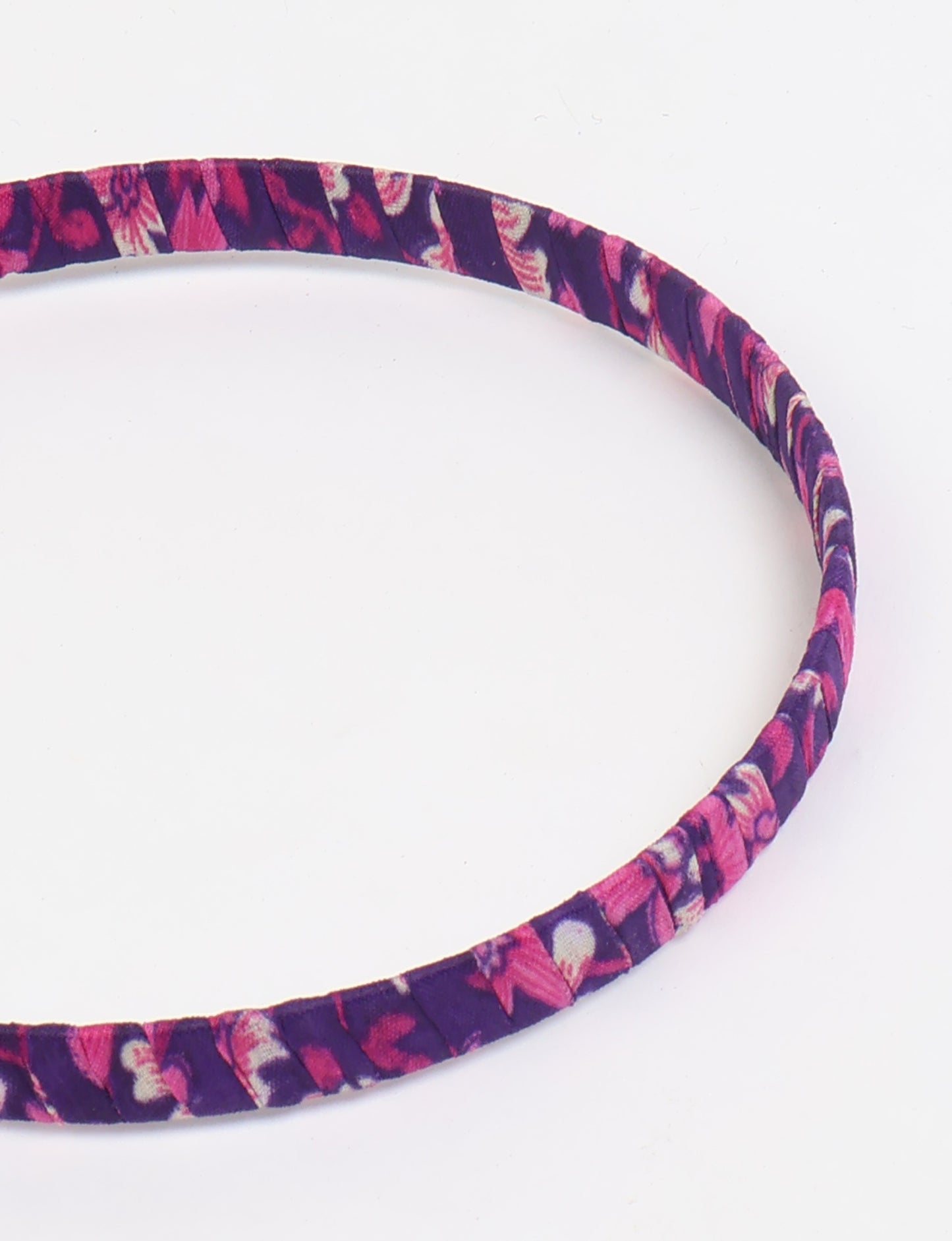 Thin fabric-wrapped metal hairband for a clean and stylish everyday look