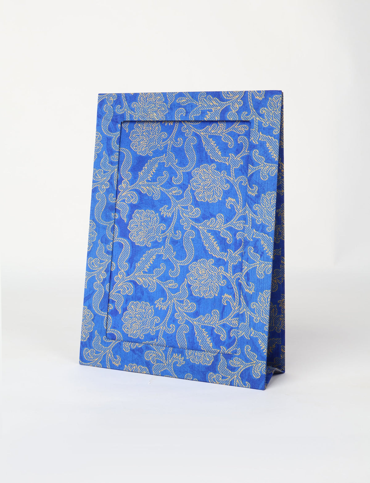 Blue photo frame with beige floral and vine pattern, standing upright on a white background, front view