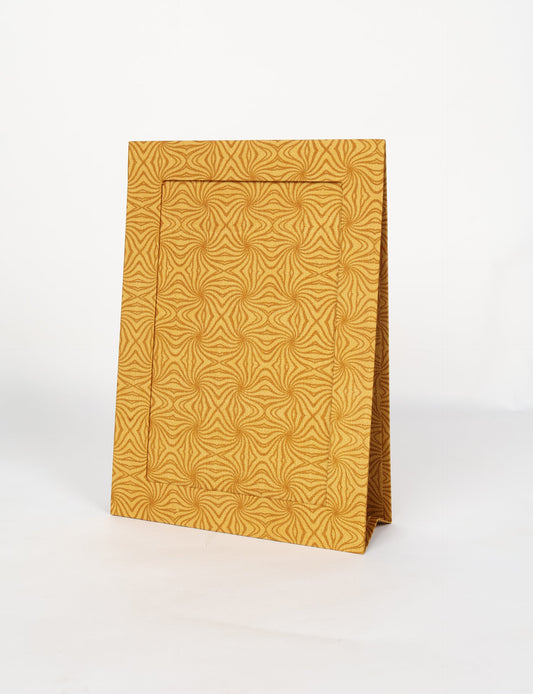 A4 size fabric photo frame with fold-out stand, made using upcycled clothing and recycled fashion concepts. Ideal for showcasing pictures, this eco friendly cloth-inspired frame highlights conscious clothing, zero waste clothing, and the essence of slow fashion.