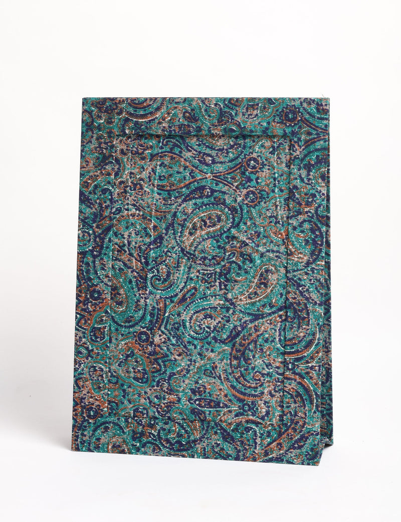 Blue paisley patterned photo frame standing upright with a textured fabric surface and A4 size visible from front angle