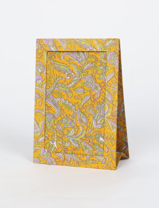 A5 rectangular fabric-covered tabletop photo frame with fold-out stand, created using upcycled clothing and repurposed clothing techniques. An eco friendly product inspired by zero waste clothing, fair trade fashion, and environmentally friendly clothing ideals, perfect for displaying photos or posters.