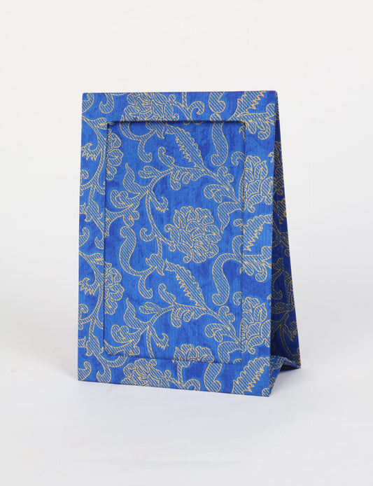 A5 rectangular fabric-covered tabletop photo frame with fold-out stand, created using upcycled clothing and repurposed clothing techniques. An eco friendly product inspired by zero waste clothing, fair trade fashion, and environmentally friendly clothing ideals, perfect for displaying photos or posters.