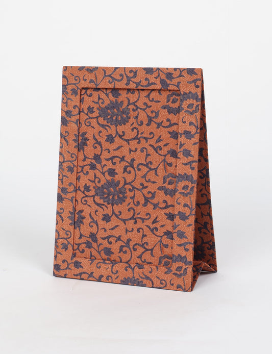 A5 rectangular fabric-covered tabletop photo frame with fold-out stand, created using upcycled clothing and repurposed clothing techniques. An eco friendly product inspired by zero waste clothing, fair trade fashion, and environmentally friendly clothing ideals, perfect for displaying photos or posters.