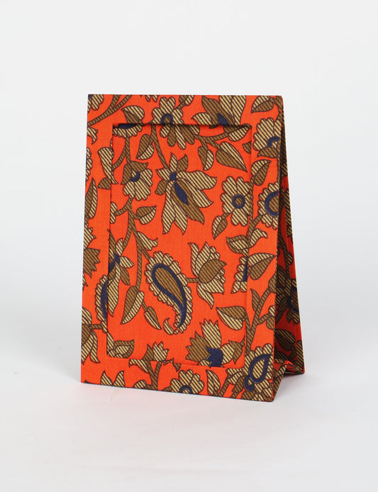 A5 rectangular fabric-covered tabletop photo frame with fold-out stand, created using upcycled clothing and repurposed clothing techniques. An eco friendly product inspired by zero waste clothing, fair trade fashion, and environmentally friendly clothing ideals, perfect for displaying photos or posters.