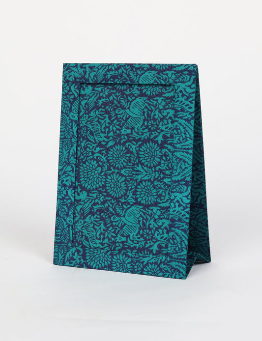 A5 rectangular fabric-covered tabletop photo frame with fold-out stand, created using upcycled clothing and repurposed clothing techniques. An eco friendly product inspired by zero waste clothing, fair trade fashion, and environmentally friendly clothing ideals, perfect for displaying photos or posters.