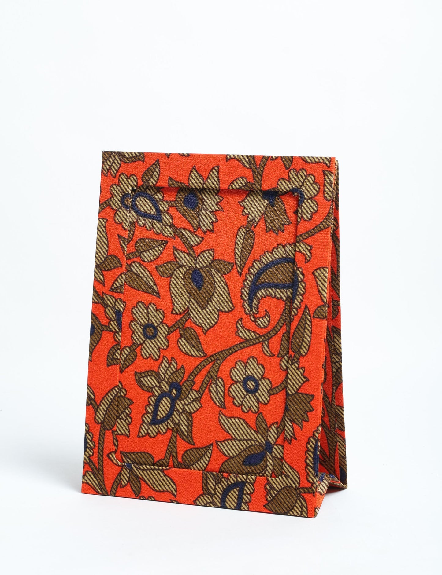 A5 rectangular fabric-covered tabletop photo frame with fold-out stand, created using upcycled clothing and repurposed clothing techniques. An eco friendly product inspired by zero waste clothing, fair trade fashion, and environmentally friendly clothing ideals, perfect for displaying photos or posters.