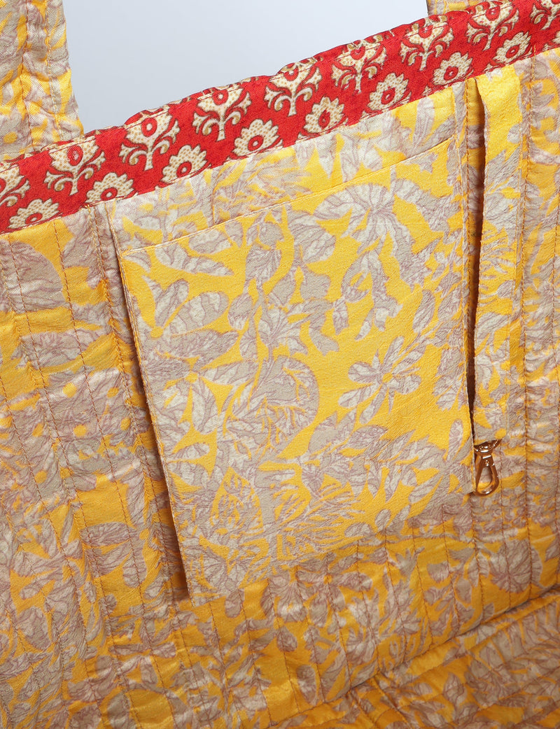 Quilted work tote bag with structured rectangular design and long shoulder straps, representing slow fashion and ethical clothing ideals, made as part of upcycled women's clothing and sustainable women's clothing using recycled fashion and earth friendly clothing practices.