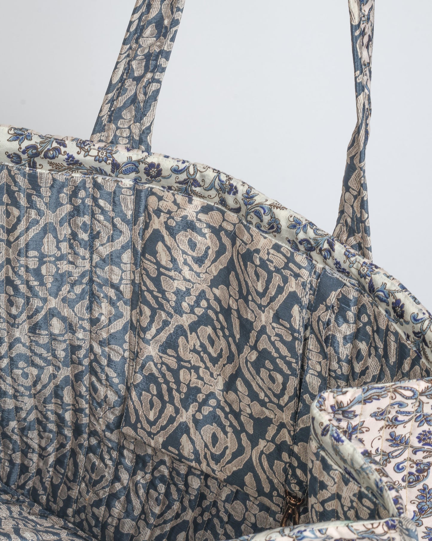 Quilted work tote bag with structured rectangular design and long shoulder straps, representing slow fashion and ethical clothing ideals, made as part of upcycled women's clothing and sustainable women's clothing using recycled fashion and earth friendly clothing practices.