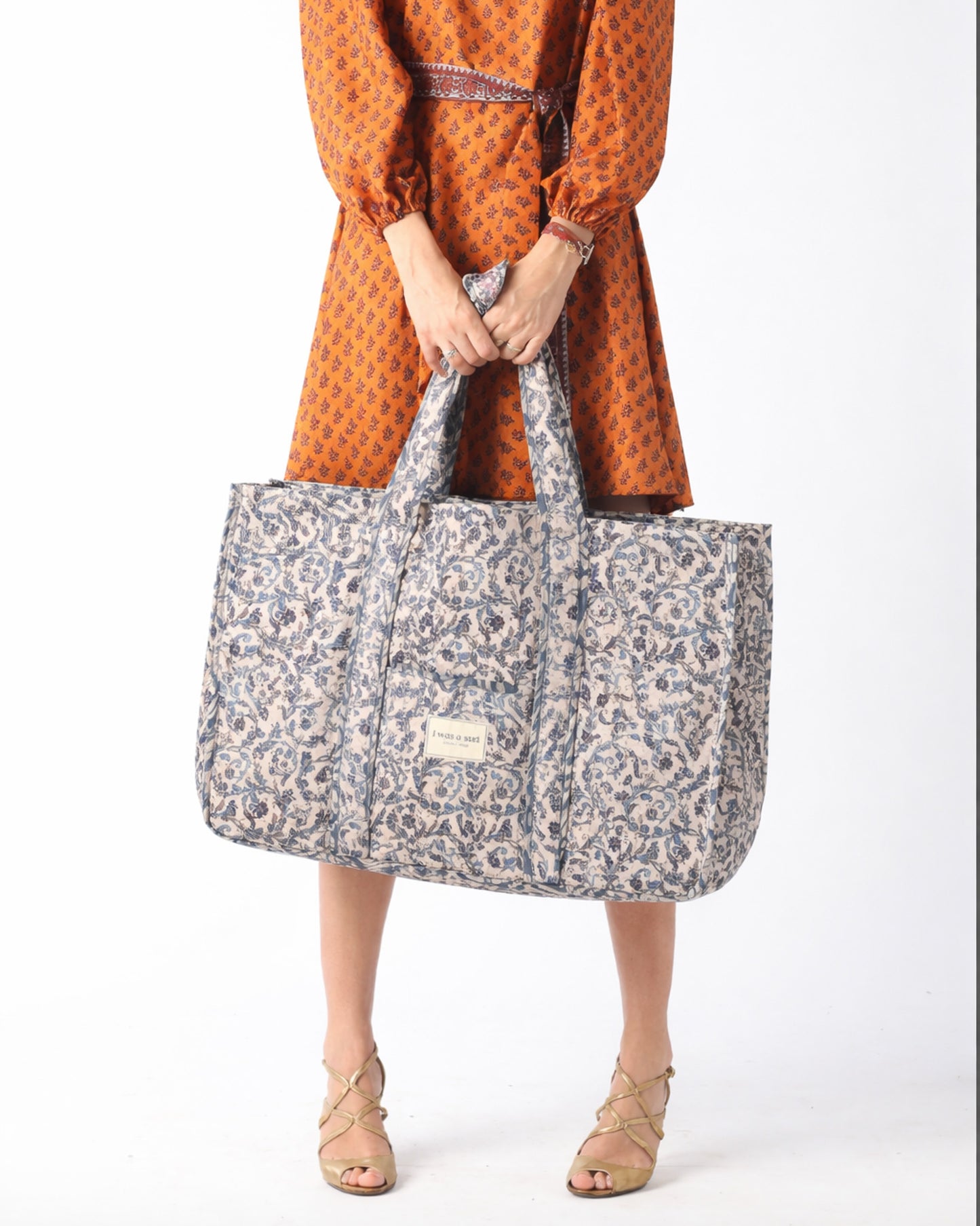 Quilted work tote bag with structured rectangular design and long shoulder straps, representing slow fashion and ethical clothing ideals, made as part of upcycled women's clothing and sustainable women's clothing using recycled fashion and earth friendly clothing practices.