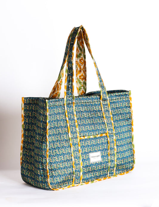 Quilted work tote bag with structured rectangular design and long shoulder straps, representing slow fashion and ethical clothing ideals, made as part of upcycled women's clothing and sustainable women's clothing using recycled fashion and earth friendly clothing practices.
