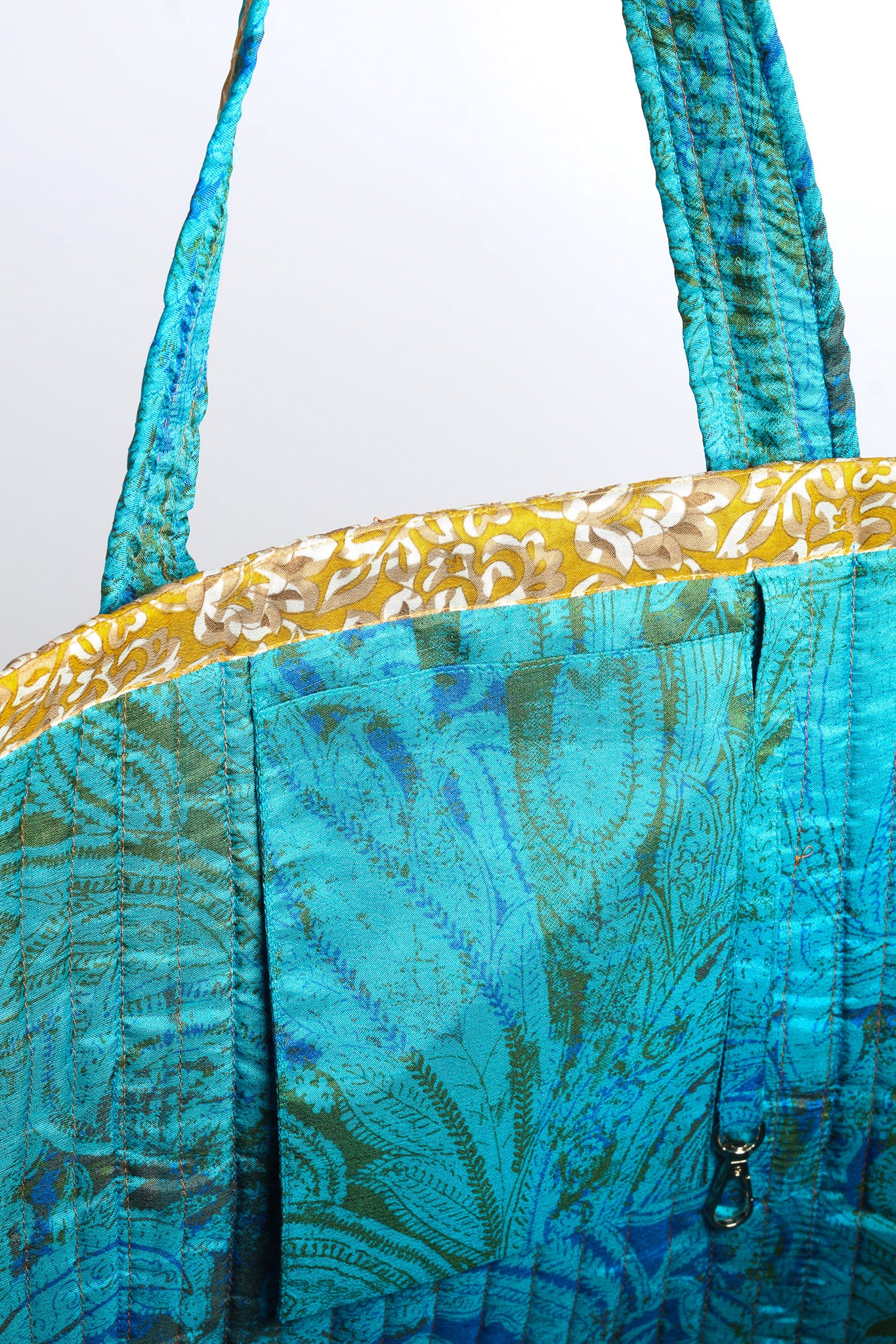 Quilted work tote bag with structured rectangular design and long shoulder straps, representing slow fashion and ethical clothing ideals, made as part of upcycled women's clothing and sustainable women's clothing using recycled fashion and earth friendly clothing practices.